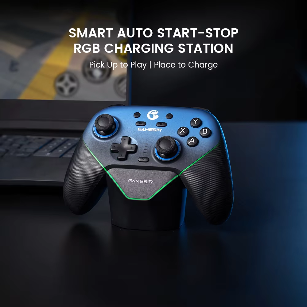 Controller sitting on its charging dock beside a laptop: pick it up to play, set it down to charge